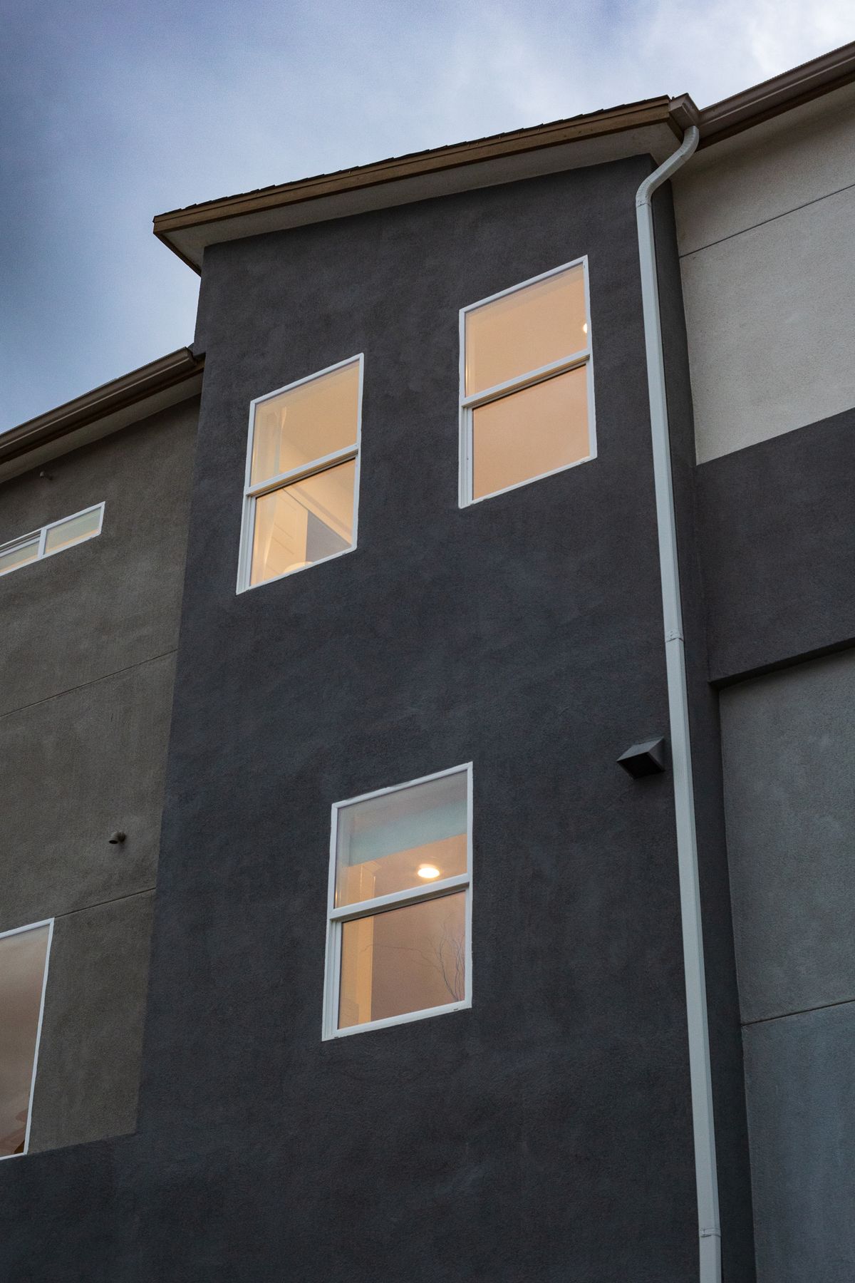 Rebuild & addition in San Jose &mdash; exterior at dusk